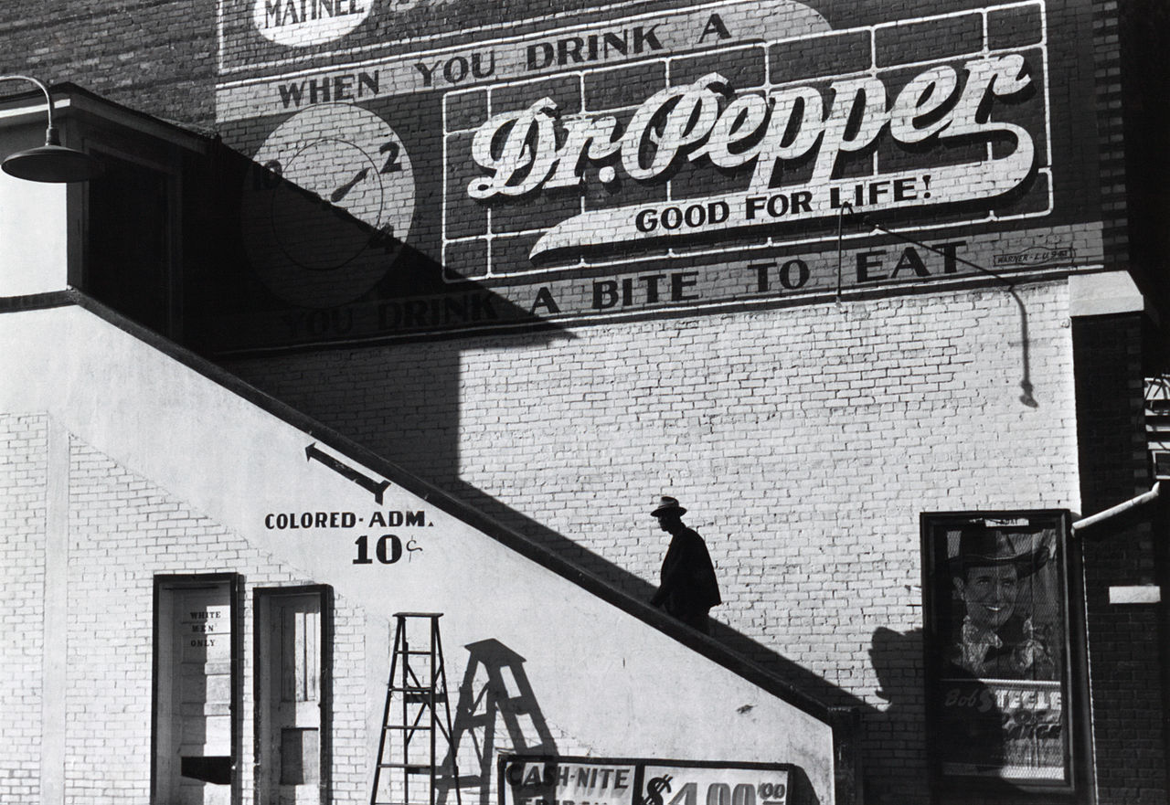 A black man enters a movie theater in Belzoni, Mississippi, in 1939.