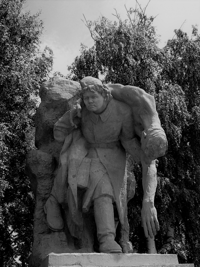 Woman Red Army auxiliary carrying a wounded soldier.